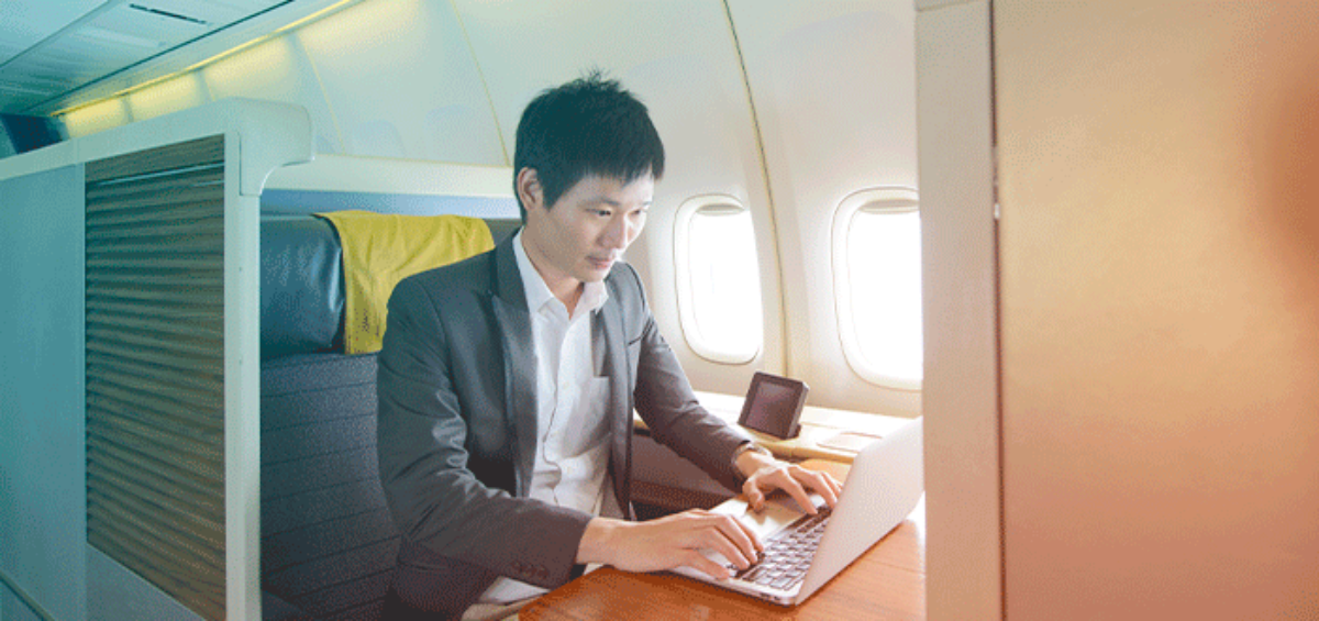 Businessman Working from a Plane